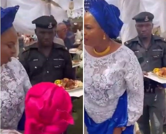 Officer Carrying Female VIP’s Food Tray