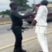 Policeman Assaulting Man