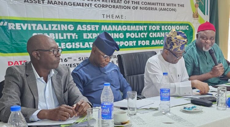 L-R: Mr Najib Sulaiman, Head of Strategy AMCON; Mr Joshua Ikioda, Group Head of Enforcement, AMCON; Mr Lucky Adaghe, Executive Director of Operations, AMCON and the Chairman, House of Representatives Committee on Banking & Ancillary Institutions, Honourable Eze Nwachukwu Eze during the House of Reps Committee retreat in Enugu State.